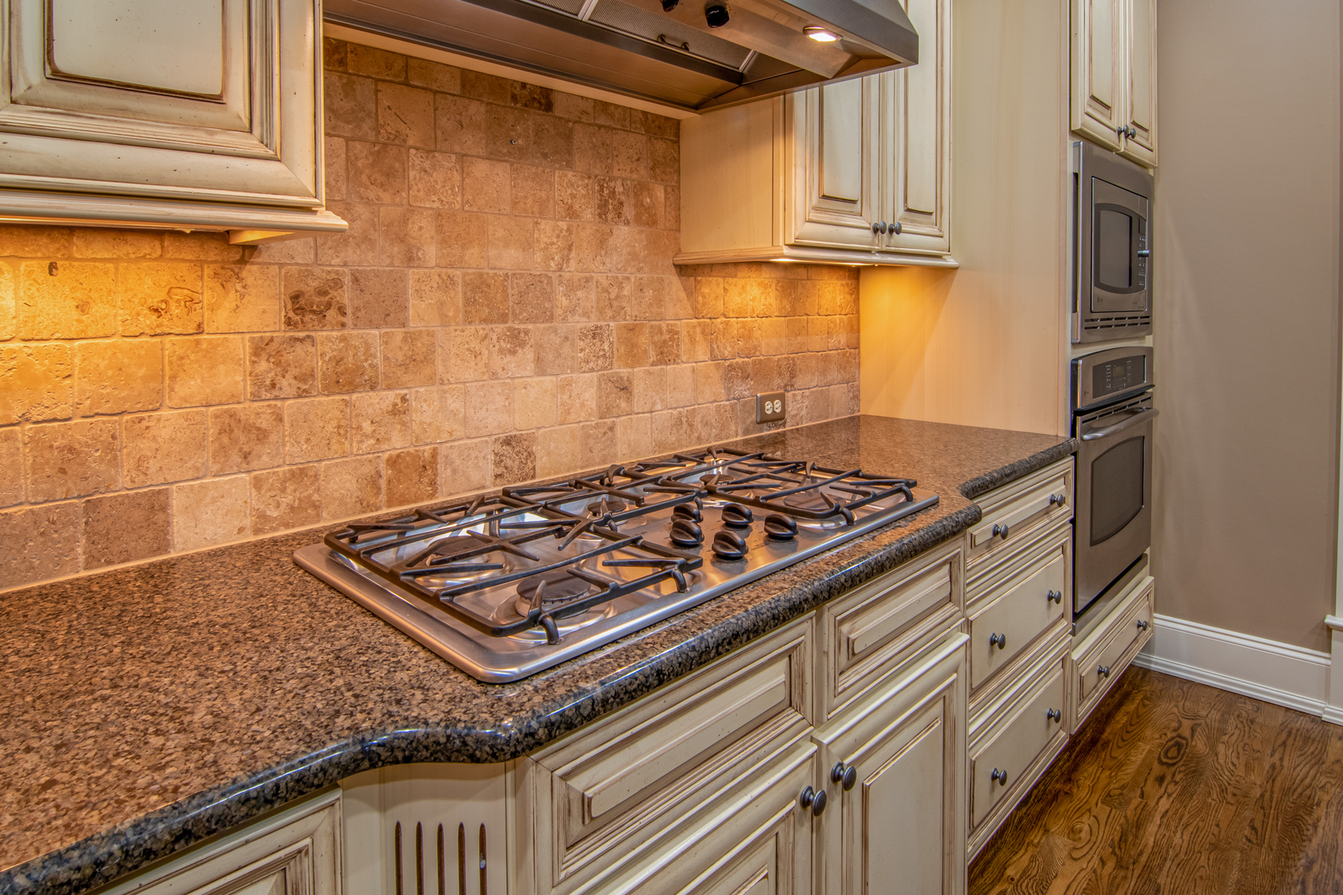 Elegant kitchen featuring granite countertops and stainless steel appliances in Riverside, CA